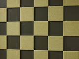 A Felt Right wall art design in a shade of green square felt tiles in a checkered pattern on a dark green wall
