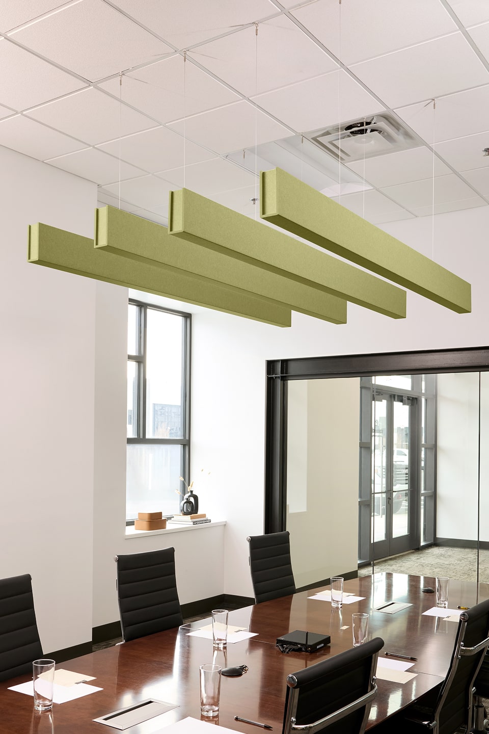 PET felt suspended acoustic beam in Aloe  by Felt Right absorbs unwanted noise and looks great in any setting. Available in four or eight foot lengths. Clips into ACT grid or drills into drywall ceiling.