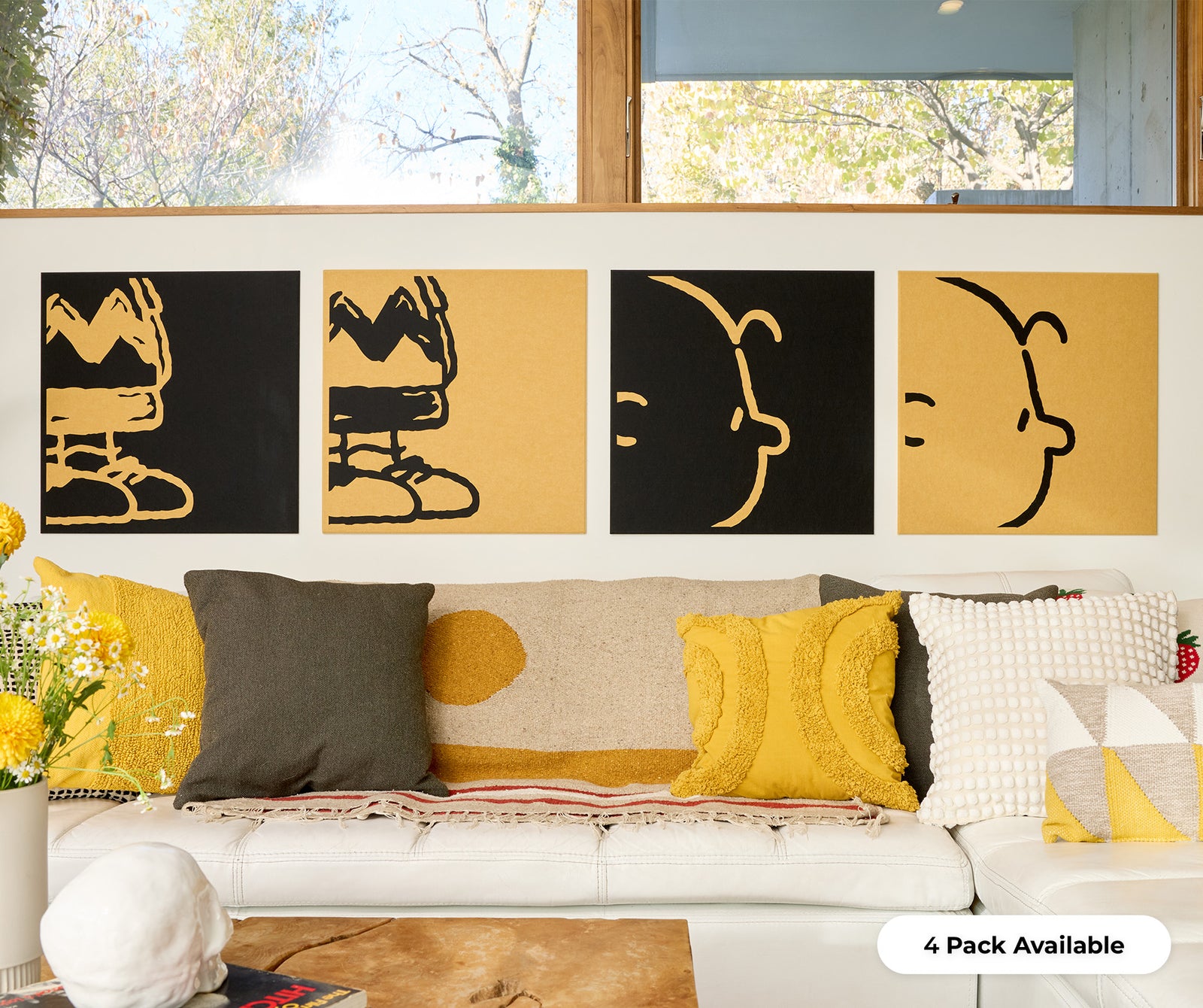 4 pack charlie brown wall decor above couch.