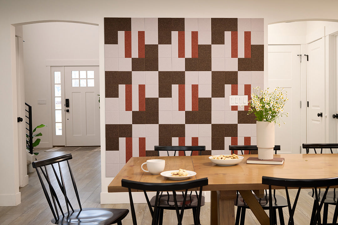 Alto Felt Right Design in the Colorway Clay on a wall next to a dining room table.