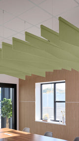 Light green acoustic ceiling blade baffles suspended from the ceiling, installed in a conference room. Felt Right's acoustic blade baffles absorb 65% of sound waves, making office spaces quieter and feel more calm.