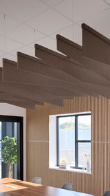Brown acoustic ceiling blade baffles suspended from the ceiling, installed in a conference room. Felt Right's acoustic blade baffles absorb 65% of sound waves, making office spaces quieter and feel more calm.