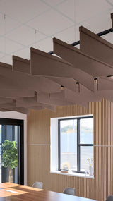 Brown fabric acoustic baffles suspended at angles from a white drop ceiling in an open office space.