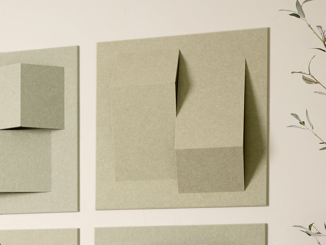 Abstract wall Felt Tiles pieces on a beige wall.