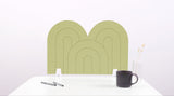 A aloe green arch-shaped desk divider on a white desk. For the side of your desk.