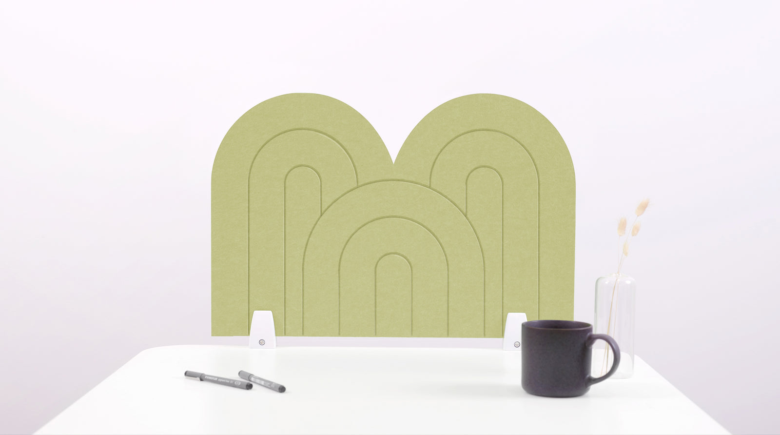 A aloe green arch-shaped desk divider on a white desk. For the side of your desk.