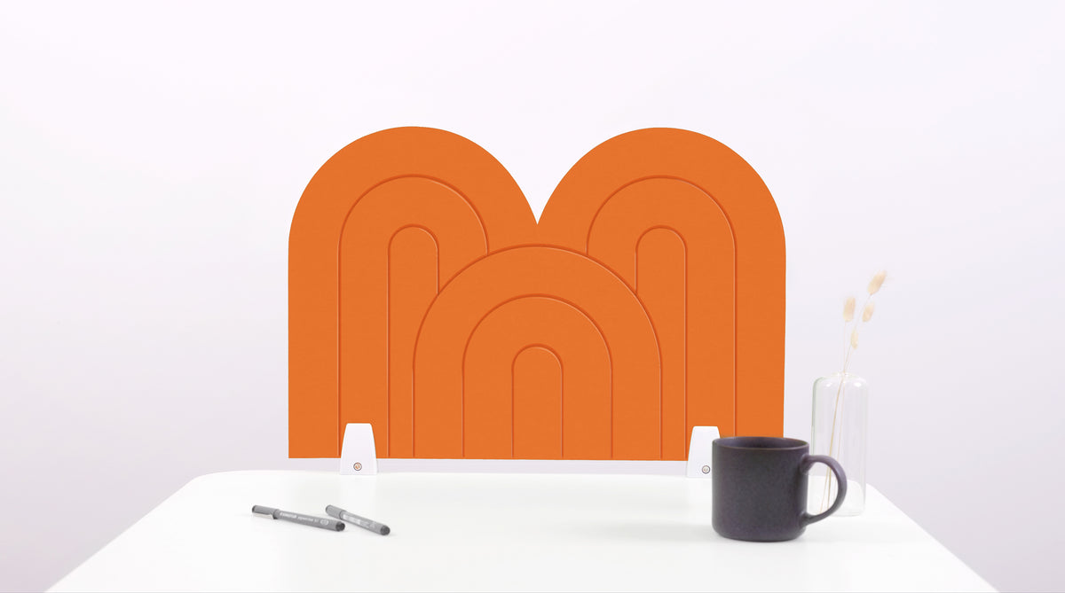 An orange arch-shaped desk divider on a white desk. For the side of your desk.