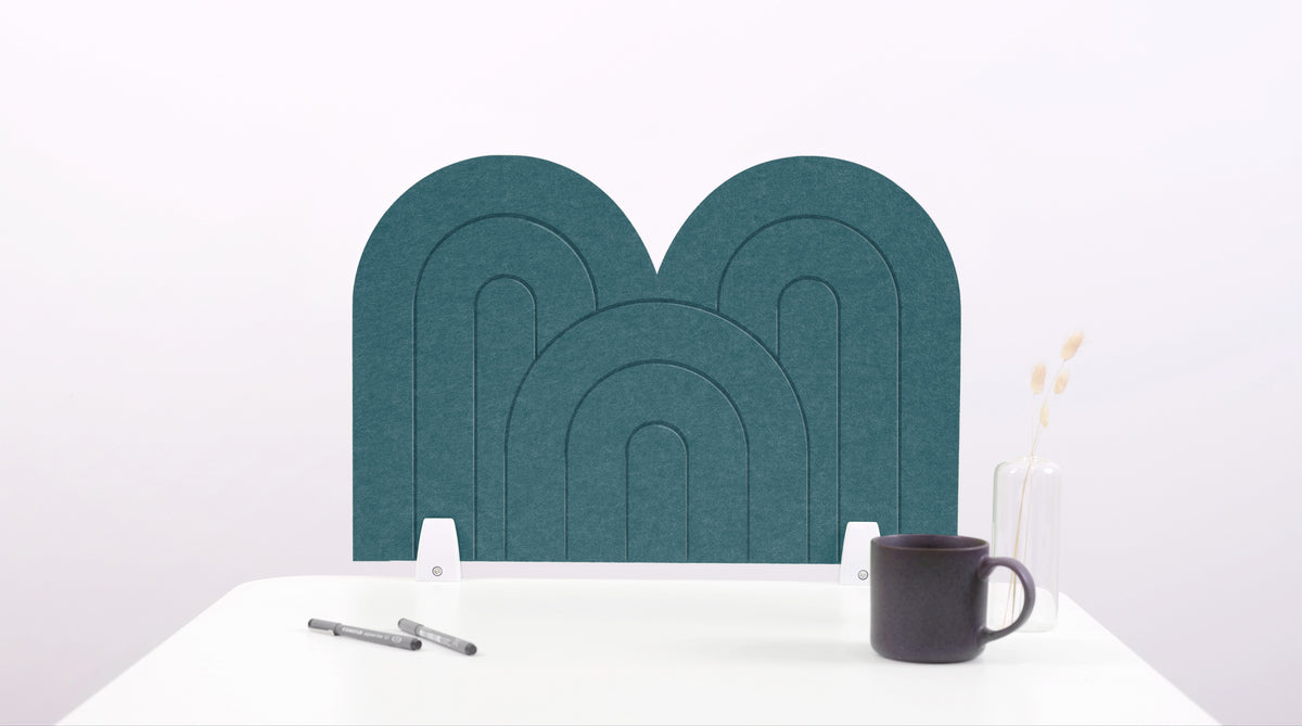 A blue arch-shaped desk divider on a white desk. For the side of your desk.