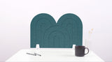 A blue arch-shaped desk divider on a white desk. For the side of your desk.