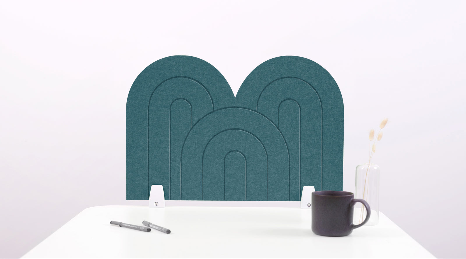 A blue arch-shaped desk divider on a white desk. For the side of your desk.