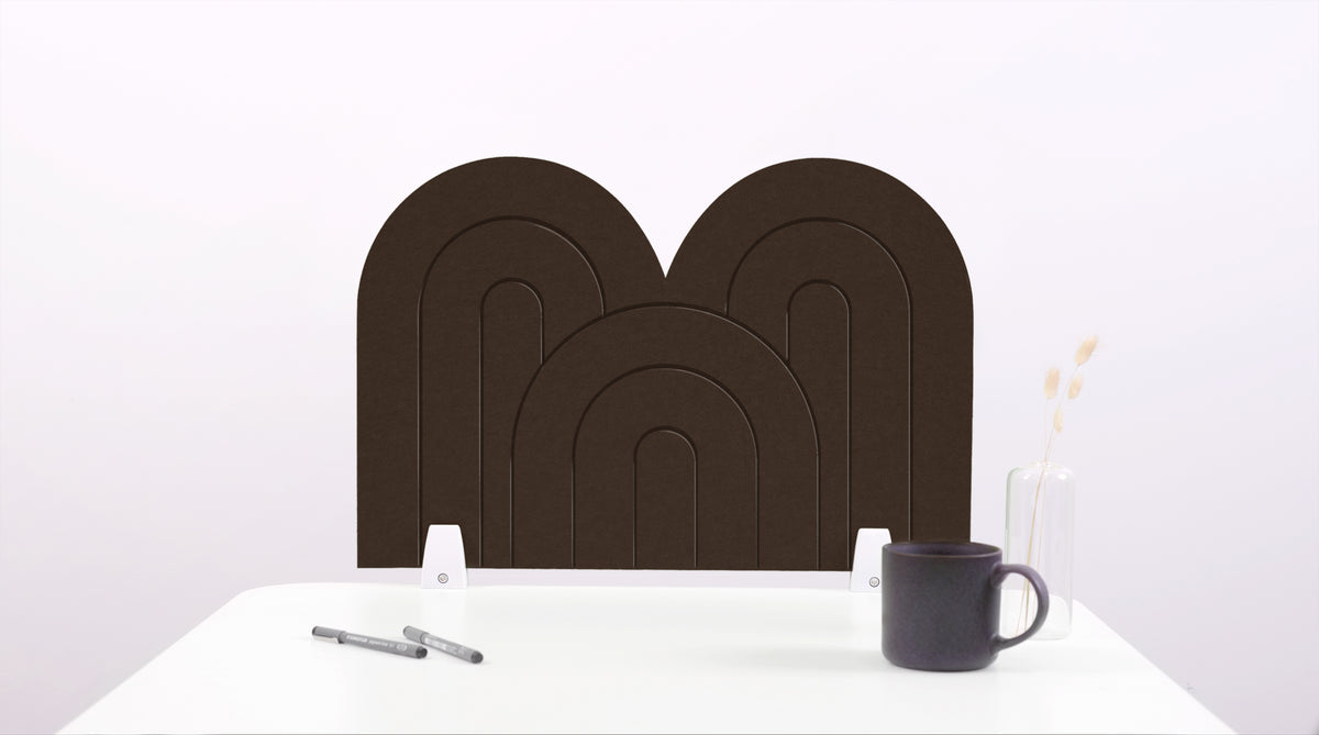 A dark brown arch-shaped desk divider on a white desk. For the side of your desk.