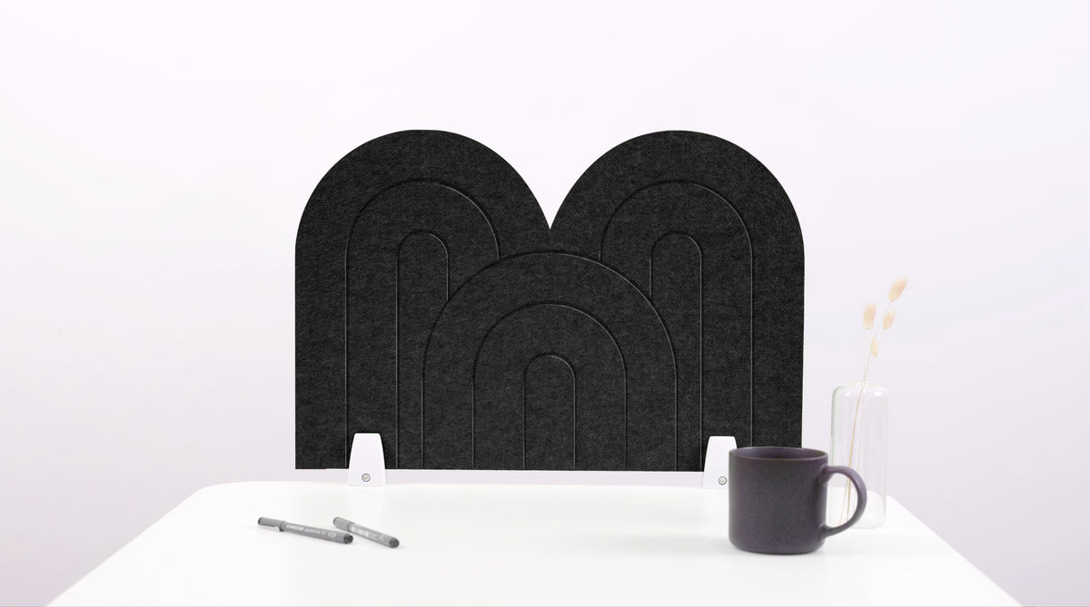 A black arch-shaped desk divider on a white desk. For the side of your desk.