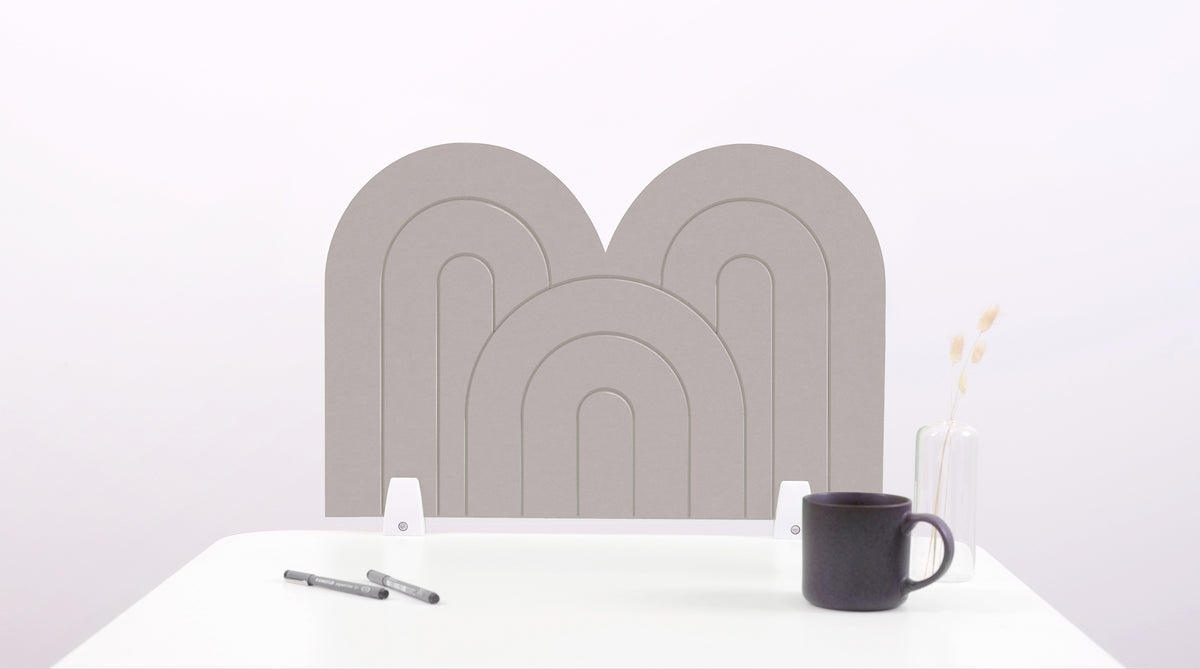A gray arch-shaped desk divider on a white desk. For the side of your desk.