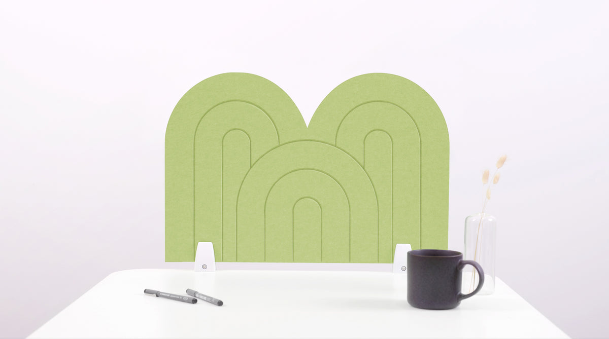 A light green arch-shaped desk divider on a white desk. For the side of your desk.