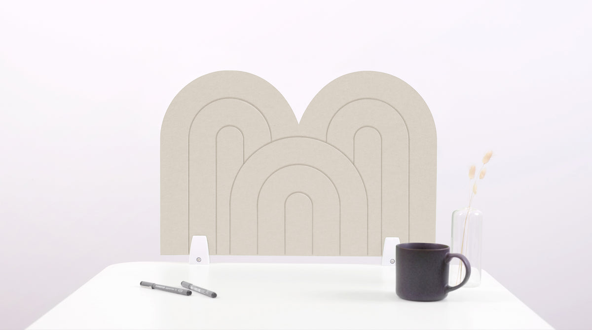 A latte colored arch-shaped desk divider on a white desk. For the side of your desk.