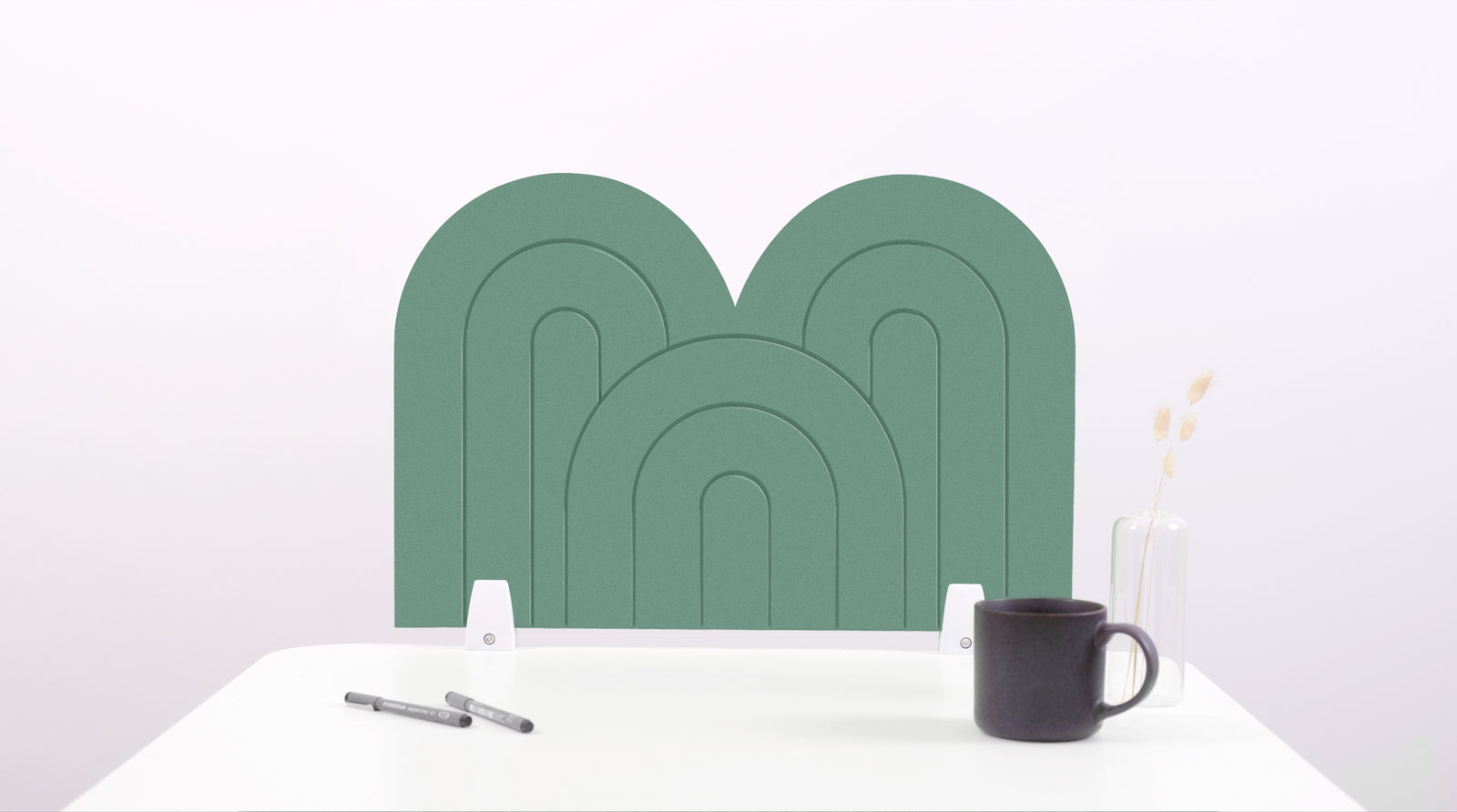 A mint green arch-shaped desk divider on a white desk. For the side of your desk.