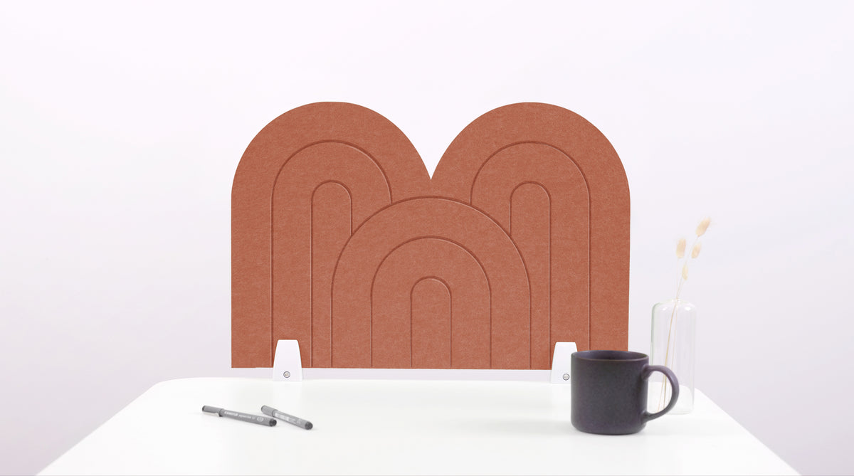 A moab colored arch-shaped desk divider on a white desk. For the side of your desk.