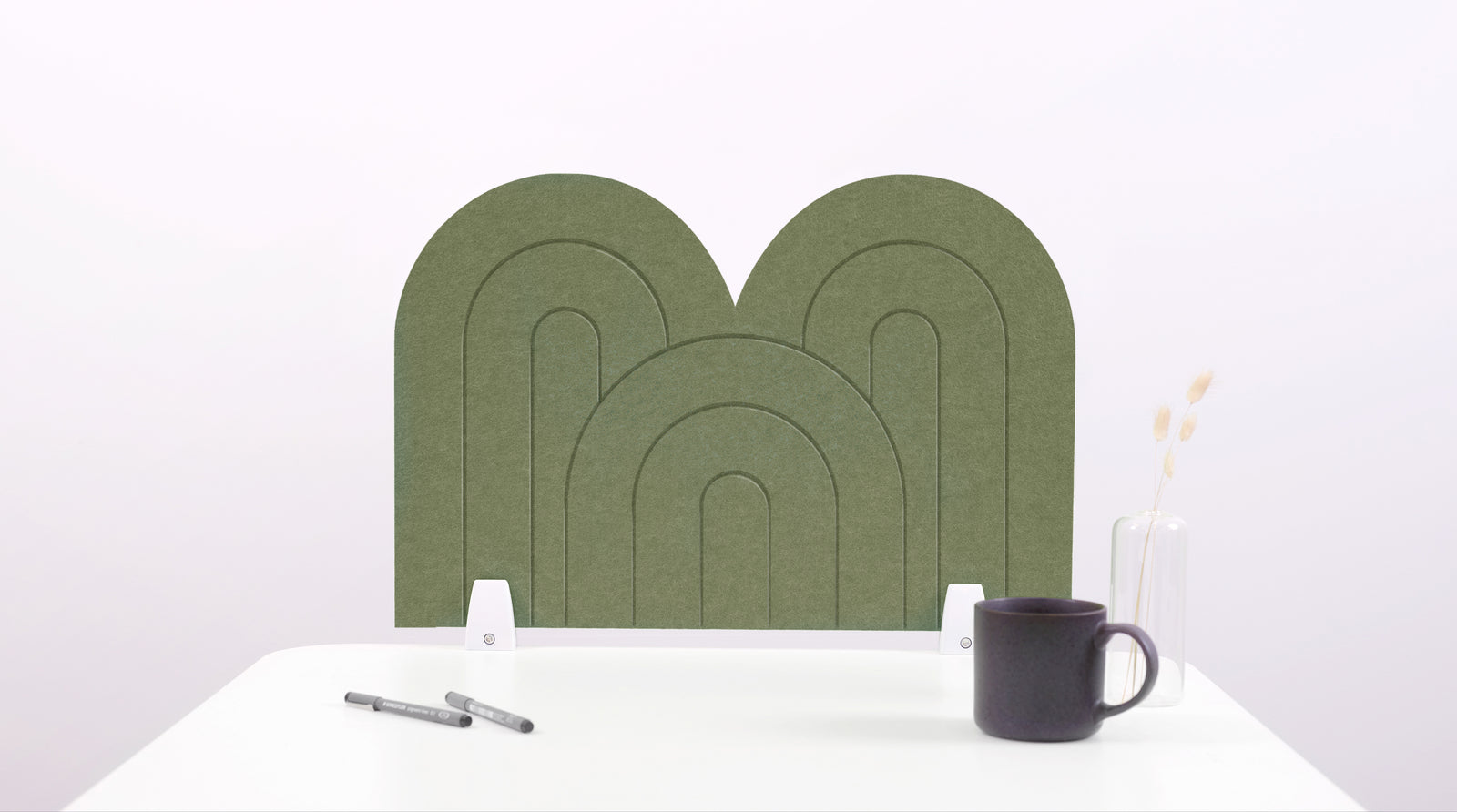 An olive arch-shaped desk divider on a white desk. For the side of your desk.