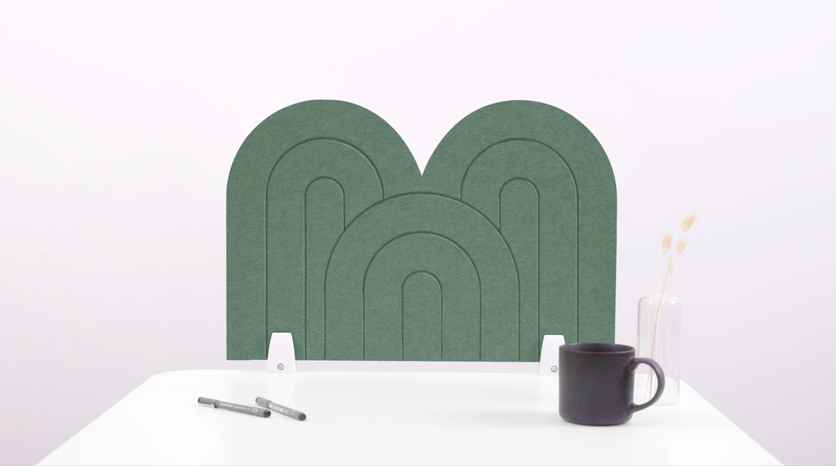 A green arch-shaped desk divider on a white desk. For the side of your desk.