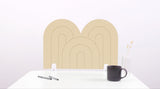 A porcelain colored arch-shaped desk divider on a white desk. For the side of your desk.