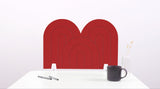 A red arch-shaped desk divider on a white desk. For the side of your desk.