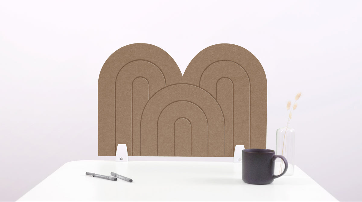 A timber colored arch-shaped desk divider on a white desk. For the side of your desk.