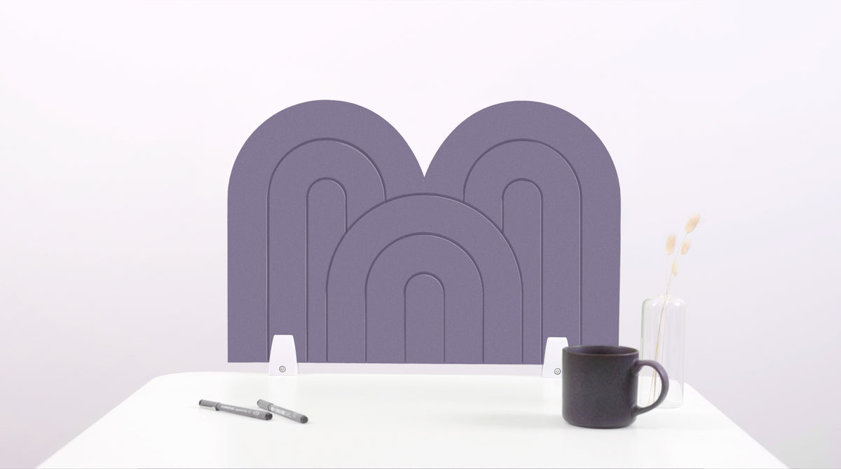 A light purple arch-shaped desk divider on a white desk. For the side of your desk.