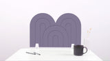 A light purple arch-shaped desk divider on a white desk. For the side of your desk.