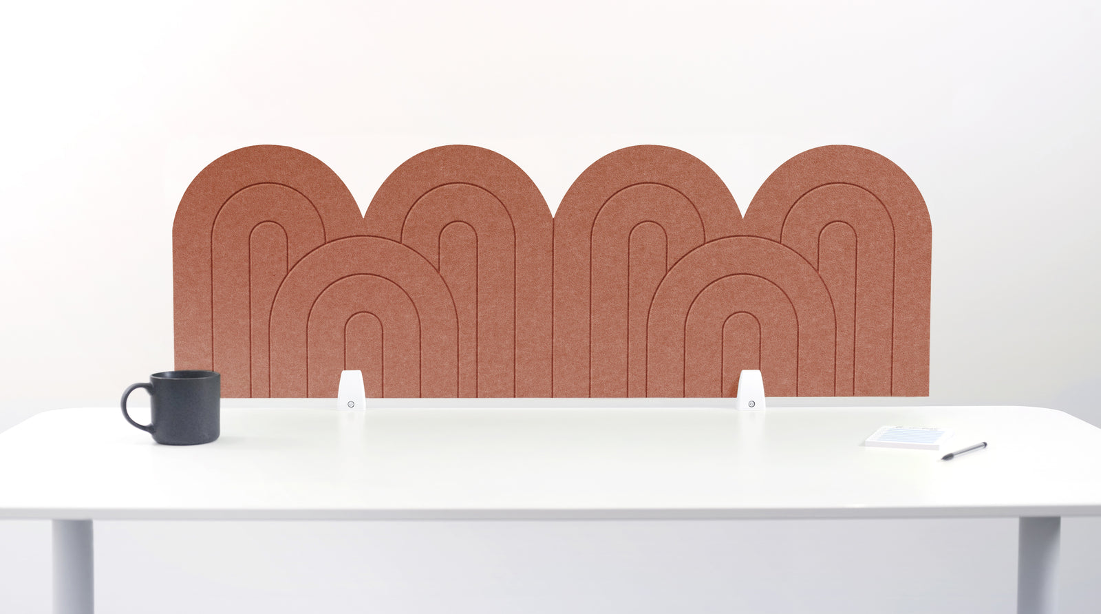  An orange arched engraved desk divider.