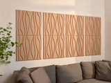 Four-panel wall art with wavy line pattern in terracotta and beige tones above a gray upholstered sofa.