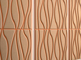 Beige fabric with layered wavy vertical lines in rust, tan, and brown tones.