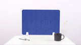 A blue colored felt desk divider with a scalloped design of lines and arches. 
