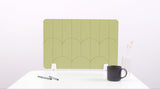 A light green colored felt desk divider with a scalloped design of lines and arches. 