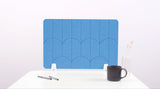 A light blue colored felt desk divider with a scalloped design of lines and arches. 