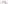 A white colored felt desk divider with a scalloped design of lines and arches. 