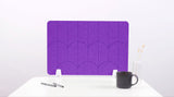 A purple lavender colored felt desk divider with a scalloped design of lines and arches. 