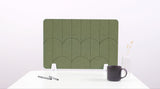 An olive green colored felt desk divider with a scalloped design of lines and arches. 