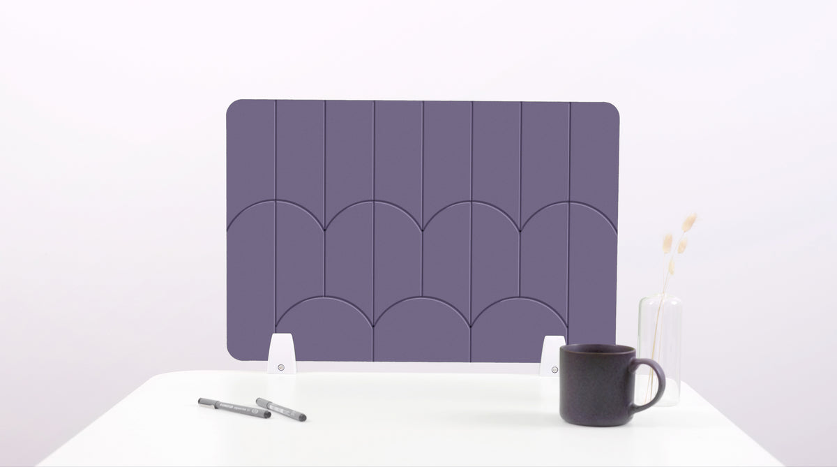 A purple colored felt desk divider with a scalloped design of lines and arches. 