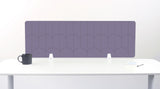 A rectangular desk divider with a purple scallop pattern, displayed on a white desk with a black mug and small accessories.