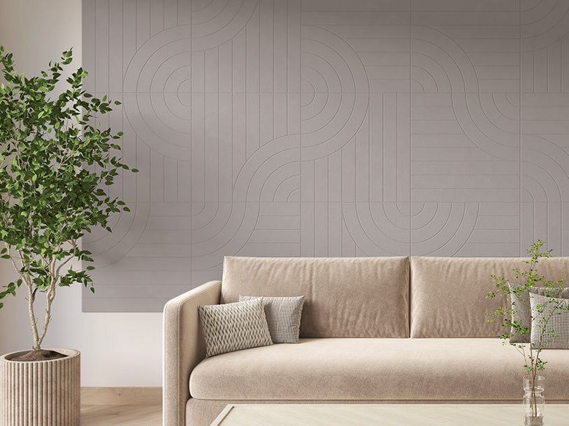 Felt Right Tangent design on a Wall covered in Felt engraved tiles in the color ash or light grey displayed in a living room behind a couch