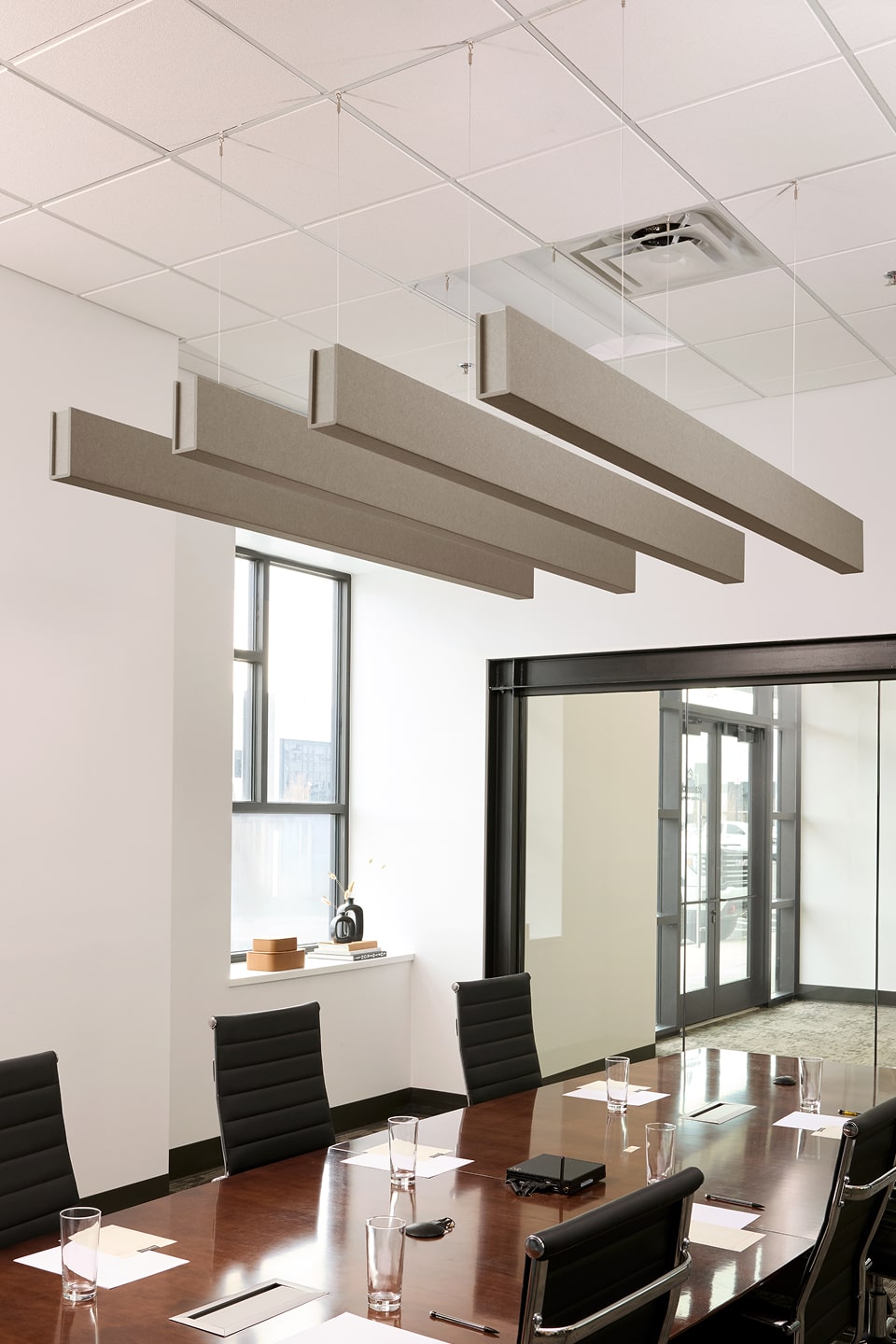 PET felt suspended acoustic beam in Ash by Felt Right absorbs unwanted noise and looks great in any setting. Available in four or eight foot lengths. Clips into ACT grid or drills into drywall ceiling.