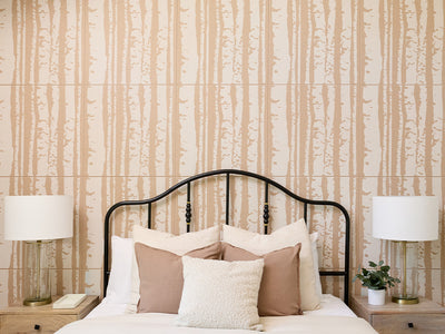 Cashmere colored Felt Right 2' x 2' tiles with white printed patterns in the shape of aspen tree trunks. There is a bed, two night stands, and two lamps in the foreground.
