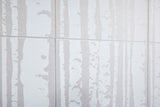 White tiles with a subtle tree pattern on a white background