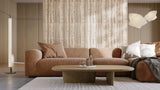 Modern living room with a brown sofa, coffee table, and decorative pillows.