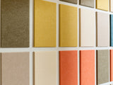 Wall of color swatches in various shades of brown, beige, and orange.