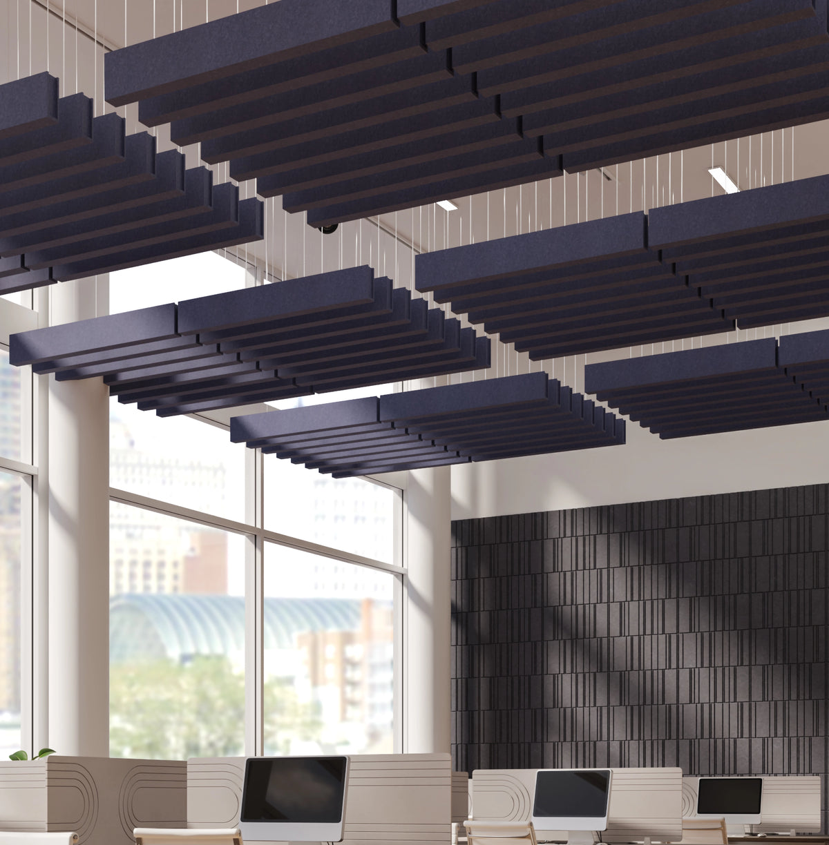 Dark navy acoustic ceiling panels suspended in a modern office interior with large windows and a textured dark accent wall.
