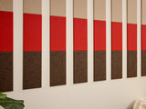 Acoustic panels with red and brown sections on a wall