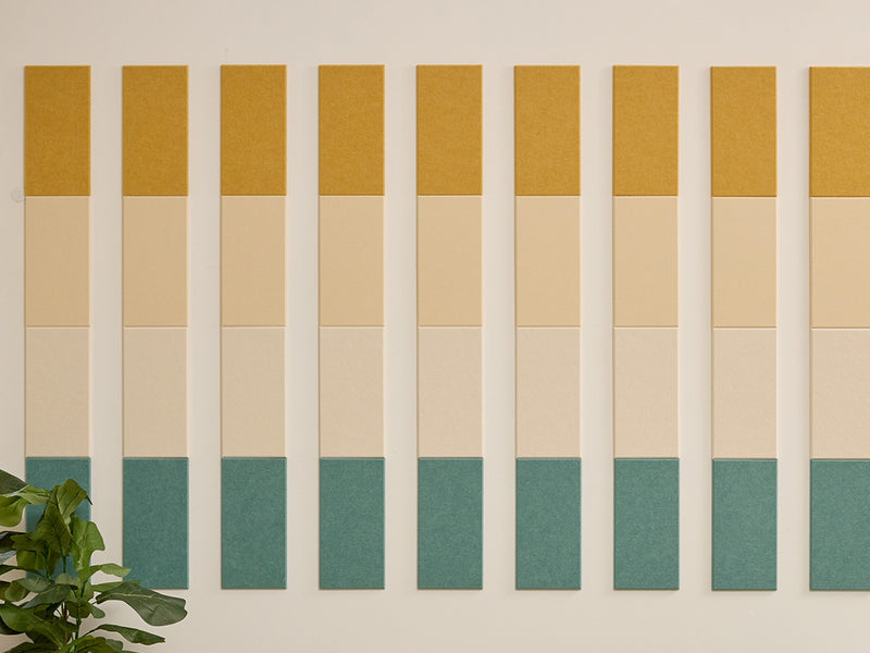 Wall with vertical color swatches in mustard, beige, and green.