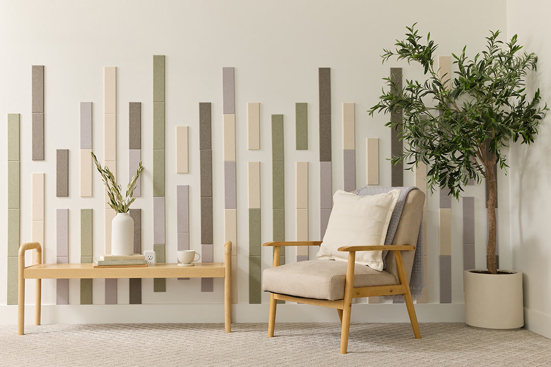 Felt Right design in a room with a decorative bamboo soho wall panel, a modern armchair, and a potted plant. Displayed in an entry way or living room