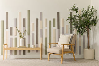 Felt Right design in a room with a decorative bamboo soho wall panel, a modern armchair, and a potted plant. Displayed in an entry way or living room